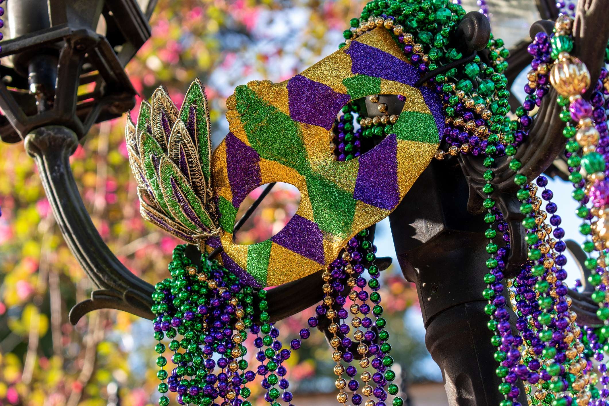 Outdoor Mardi Gras beads and mask decorations for Mardi Gras 2023 in New Orleans