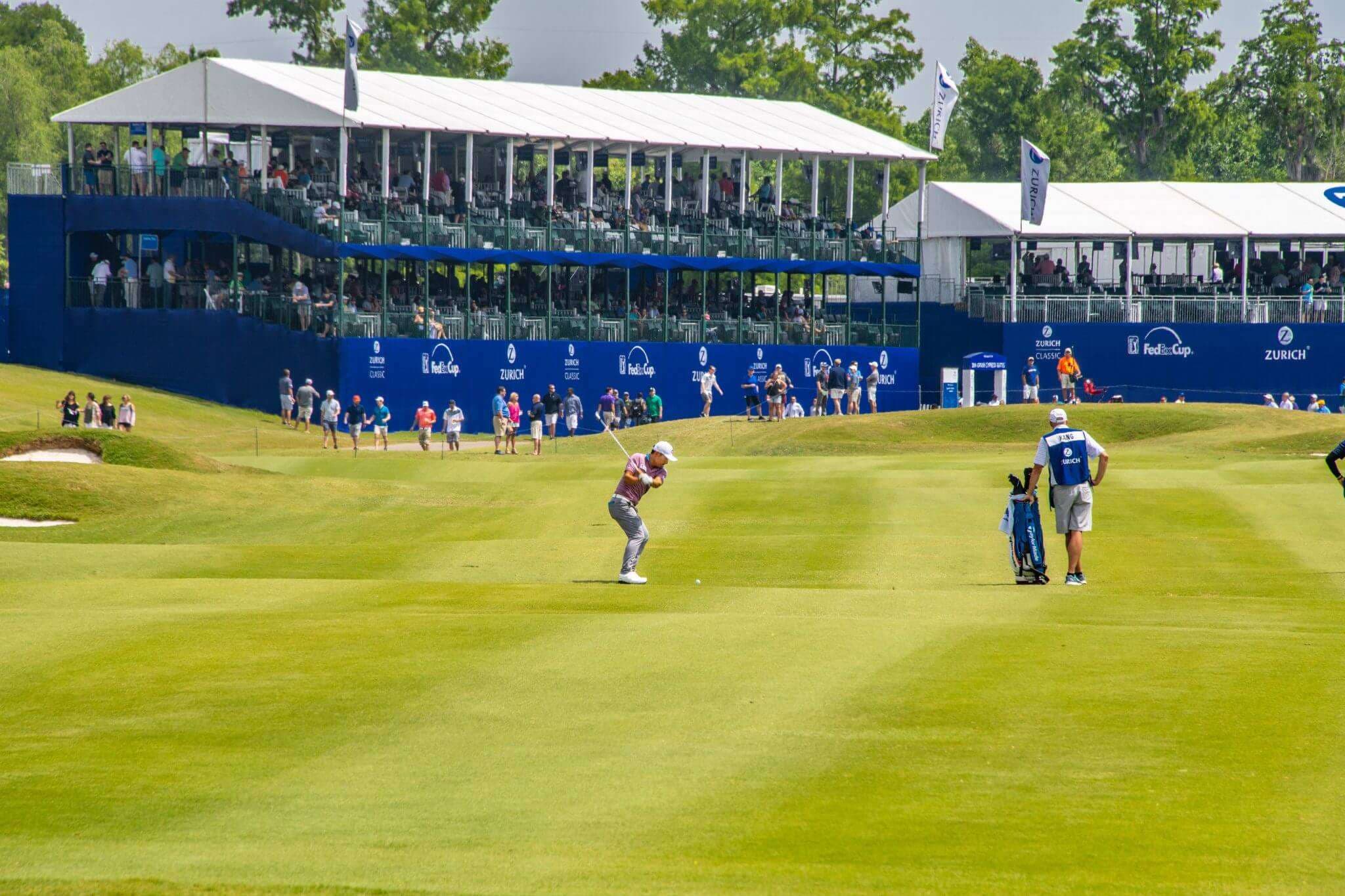 People playing gold outside at TPC Louisiana