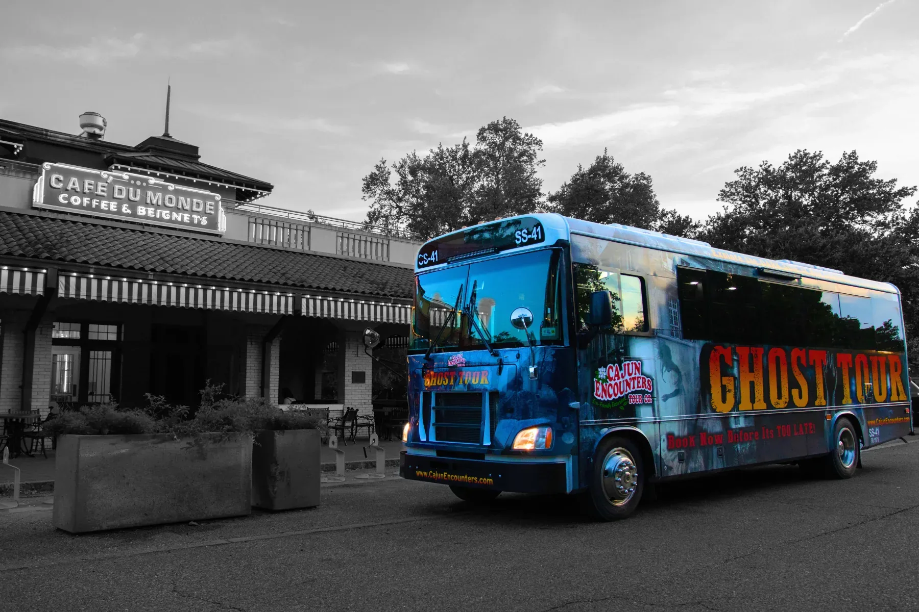 Ghost tour bus parked outside Cafe du Monde in New Orleans